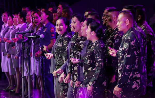PNP and AFP choral performs as they sing their piece for the Songs For Heroes Concert "A Benefit Concert for the Gallant 44" at the SM Mall of Asia (MOA) (Prince Maverick Medina Marquez/Photoville International )